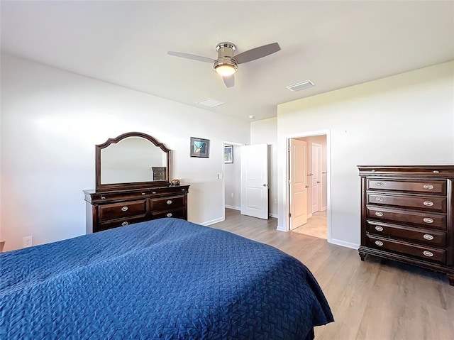 bedroom with visible vents, ceiling fan, light wood-style flooring, and baseboards