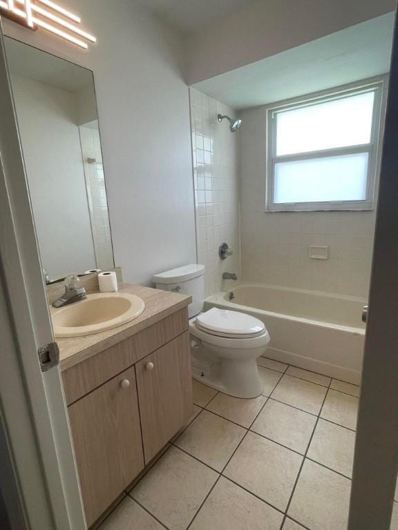 full bathroom featuring shower / tub combination, vanity, toilet, and tile patterned floors