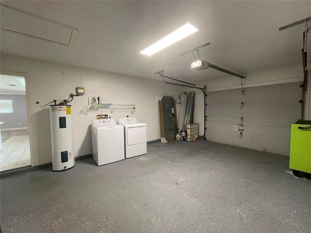 garage with a garage door opener, separate washer and dryer, and electric water heater