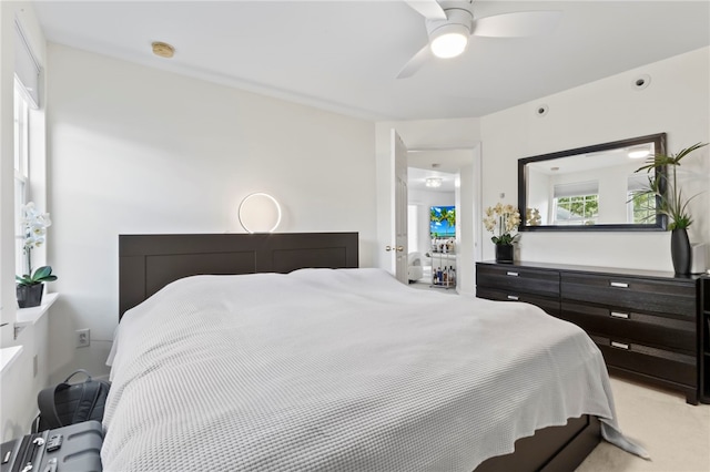 carpeted bedroom with ceiling fan