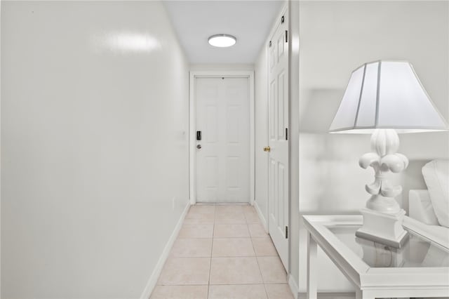 hallway featuring light tile patterned flooring