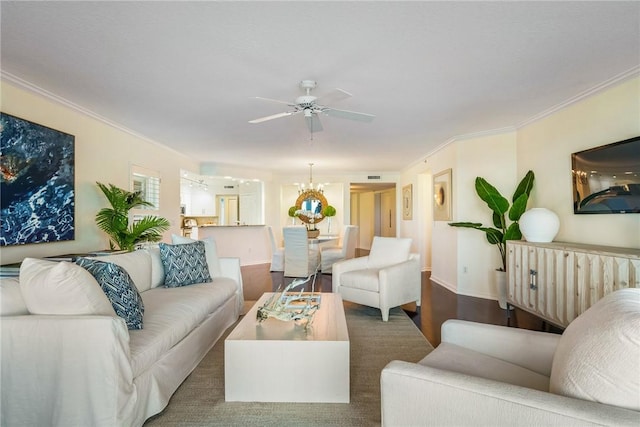 living room with dark wood-style floors, ceiling fan, ornamental molding, and baseboards