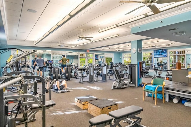 gym with a ceiling fan and visible vents