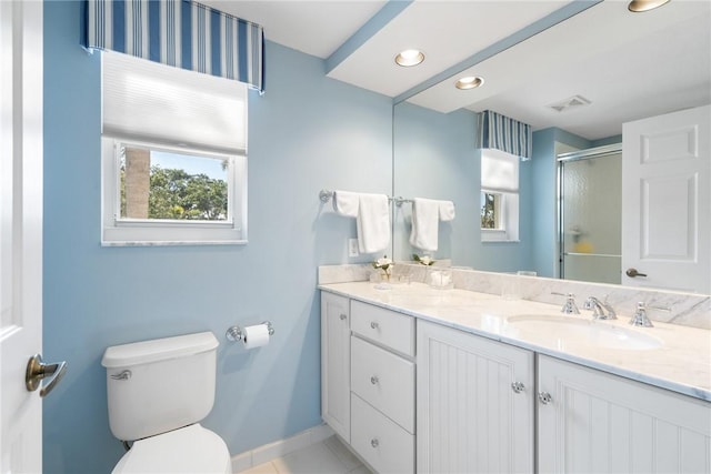 bathroom with double vanity, visible vents, toilet, a shower stall, and a sink