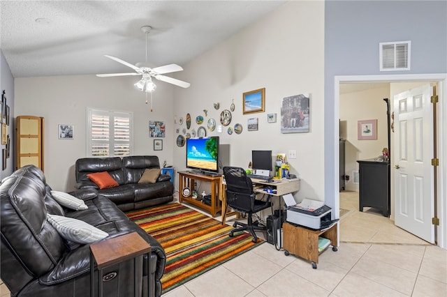 tiled office space with ceiling fan, a textured ceiling, and high vaulted ceiling