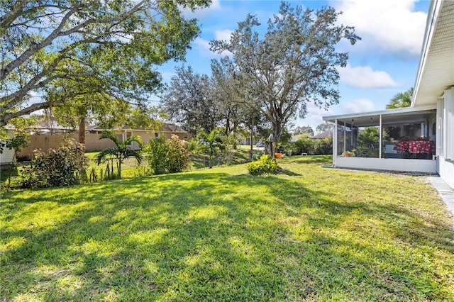 view of yard with a sunroom