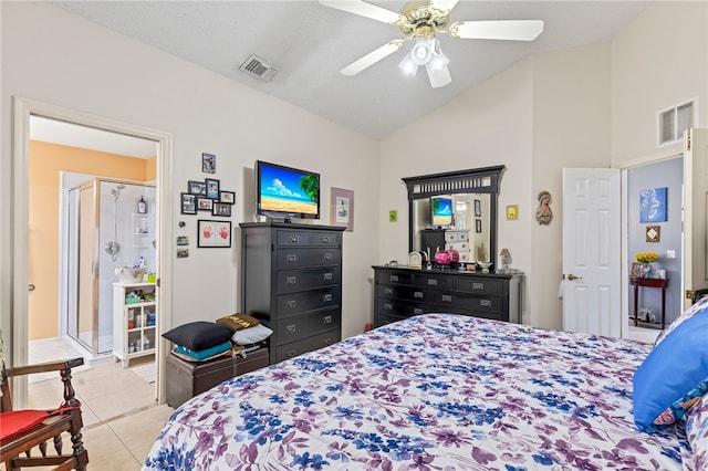 tiled bedroom featuring ceiling fan, a textured ceiling, and vaulted ceiling