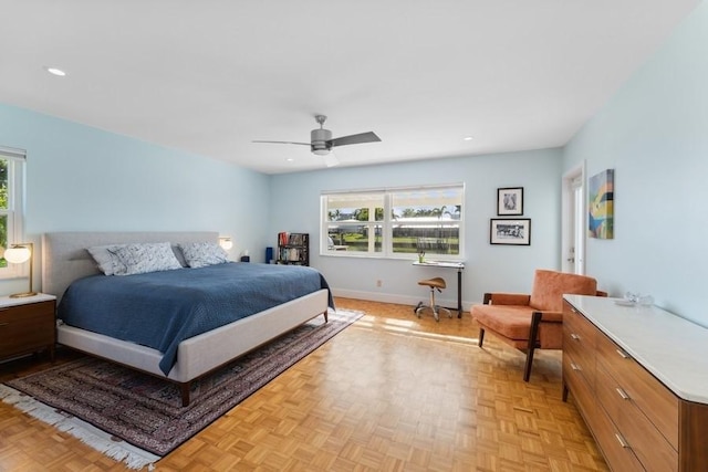 bedroom with light parquet floors and ceiling fan