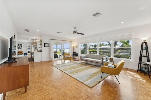 living room featuring ceiling fan and light parquet flooring