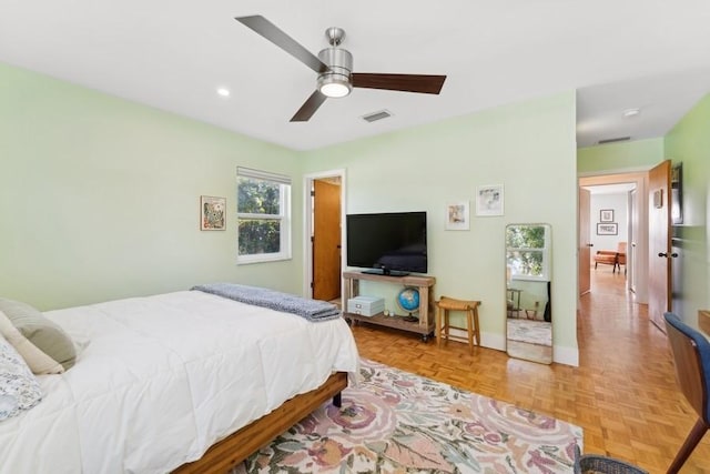 bedroom featuring light parquet flooring and ceiling fan