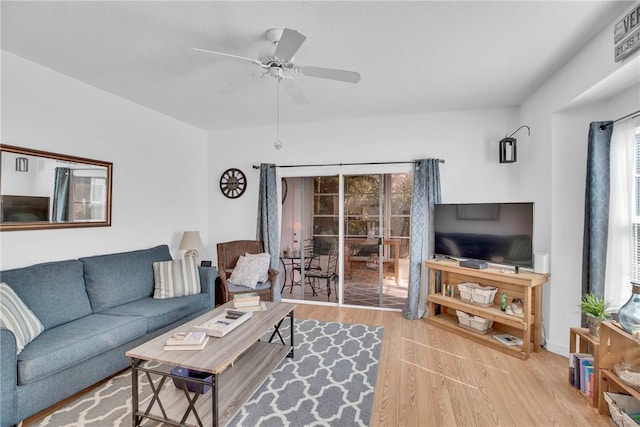 living area featuring ceiling fan and wood finished floors