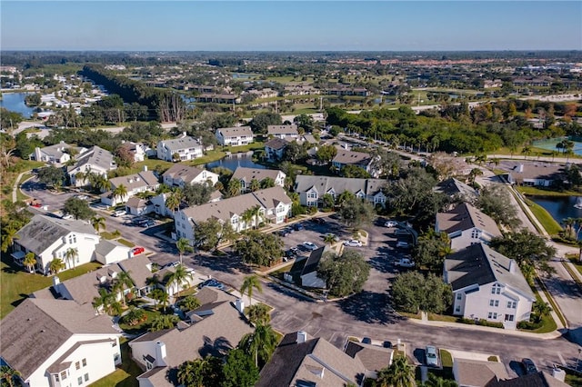 bird's eye view with a water view and a residential view