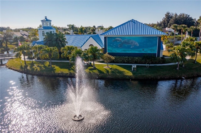 surrounding community with a water view