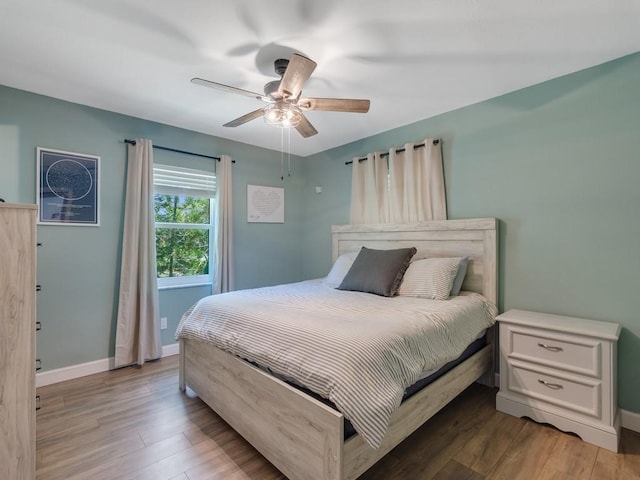 6345 7th Ln, Vero Beach, FL 32968 - bedroom featuring wood finished floors and a ceiling fan