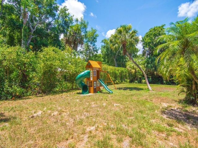 6345 7th Ln, Vero Beach, FL 32968 - community jungle gym featuring a yard