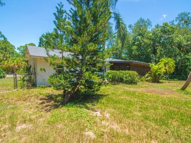 6345 7th Ln, Vero Beach, FL 32968 - view of yard featuring a sunroom