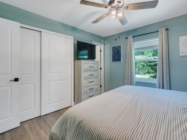 6345 7th Ln, Vero Beach, FL 32968 - bedroom featuring wood finished floors, a closet, and a ceiling fan
