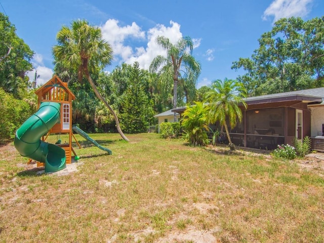 6345 7th Ln, Vero Beach, FL 32968 - view of green lawn featuring a playground