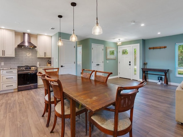 6345 7th Ln, Vero Beach, FL 32968 - dining room with light wood-style floors and recessed lighting