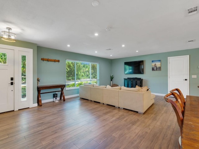 6345 7th Ln, Vero Beach, FL 32968 - living room with light wood-type flooring and recessed lighting