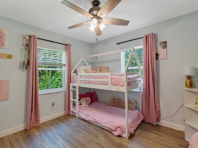 6345 7th Ln, Vero Beach, FL 32968 - bedroom featuring wood finished floors and ceiling fan