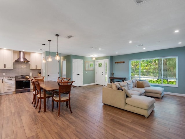6345 7th Ln, Vero Beach, FL 32968 - dining room with light wood finished floors and recessed lighting