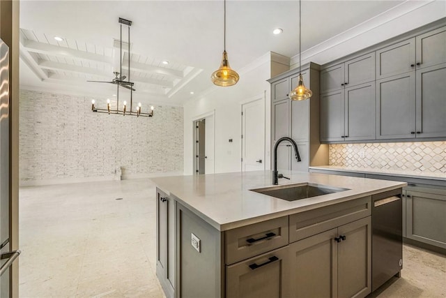 kitchen featuring a center island with sink, beam ceiling, gray cabinets, a sink, and backsplash