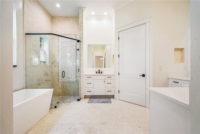 full bath with vanity, recessed lighting, a stall shower, ornamental molding, and a freestanding bath