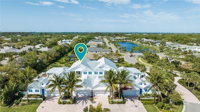 birds eye view of property featuring a residential view and a water view