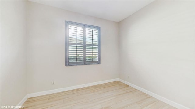 652 Hatteras Ct SW, Vero Beach, FL 32968 - unfurnished room with baseboards and wood finished floors