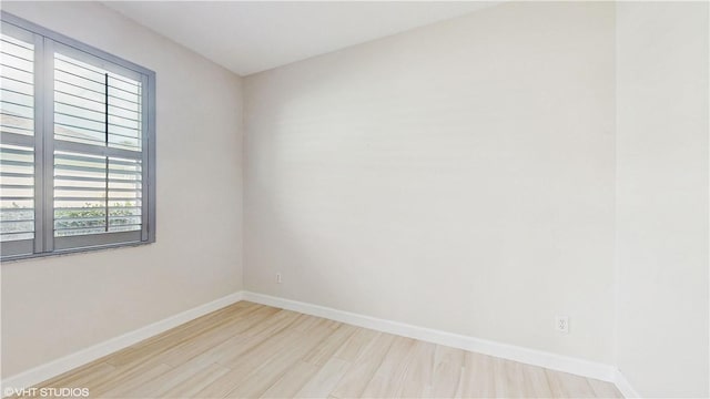 652 Hatteras Ct SW, Vero Beach, FL 32968 - spare room featuring baseboards and wood finished floors