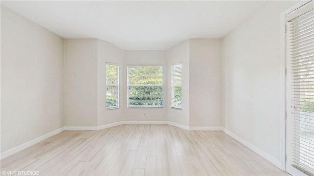 652 Hatteras Ct SW, Vero Beach, FL 32968 - empty room with light wood-style flooring and baseboards