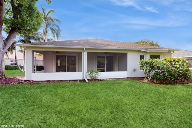 652 Hatteras Ct SW, Vero Beach, FL 32968 - rear view of property featuring stucco siding, ceiling fan, a yard, and a sunroom