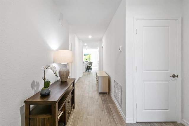 hallway with light wood-type flooring