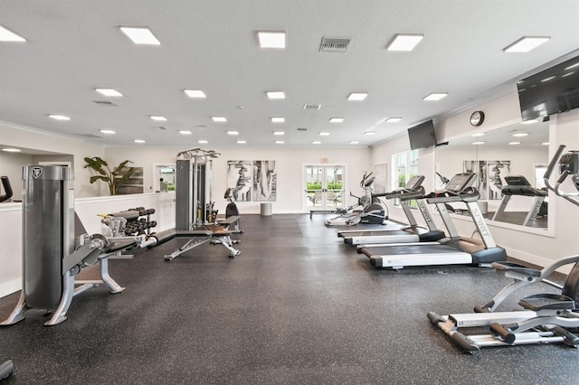 exercise room with a textured ceiling