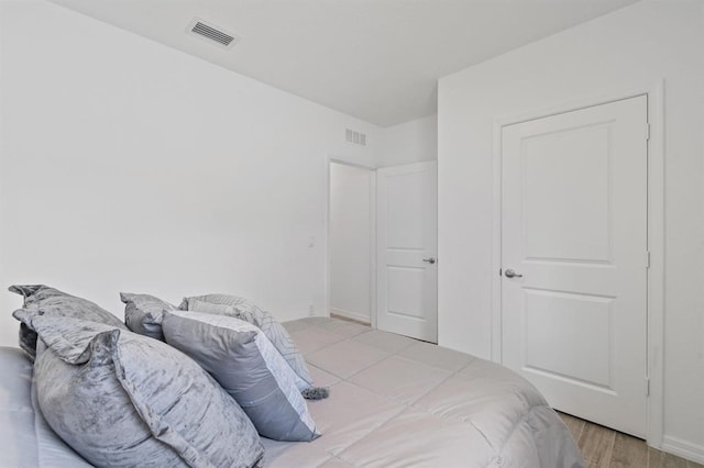 bedroom featuring light hardwood / wood-style flooring