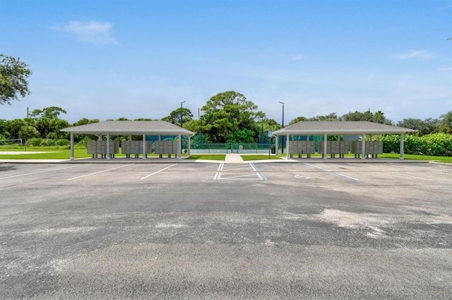 view of parking with mail boxes