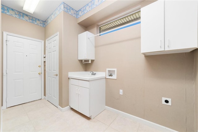 washroom with washer hookup, sink, cabinets, and hookup for an electric dryer