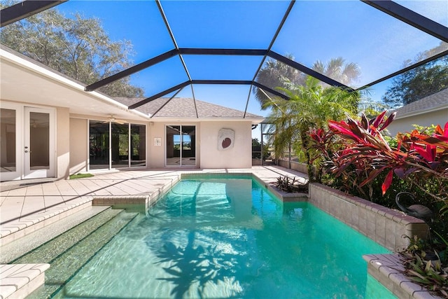 view of pool featuring a lanai and a patio