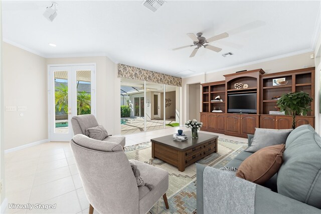 living room with ceiling fan, ornamental molding, and light tile patterned floors