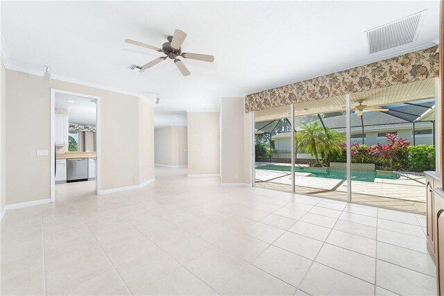 tiled empty room featuring crown molding and ceiling fan