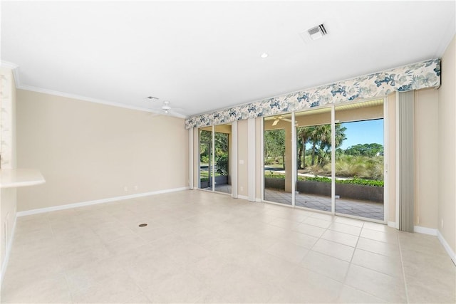 empty room featuring crown molding, light tile patterned flooring, and ceiling fan