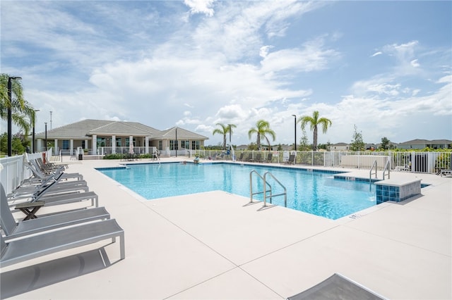 view of swimming pool featuring a patio area