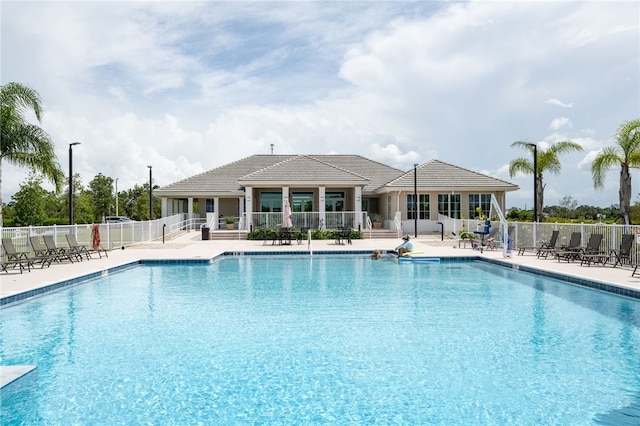 view of swimming pool with a patio