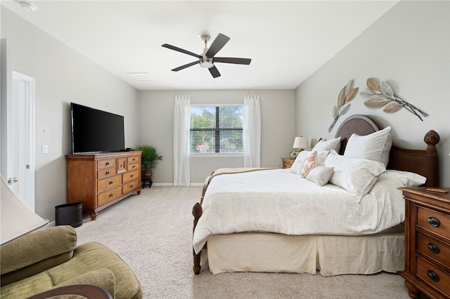 bedroom with ceiling fan and light colored carpet