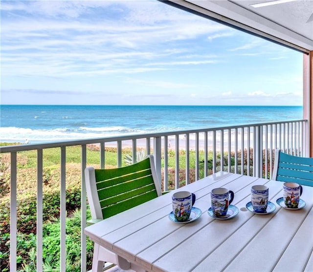 balcony with a view of the beach and a water view