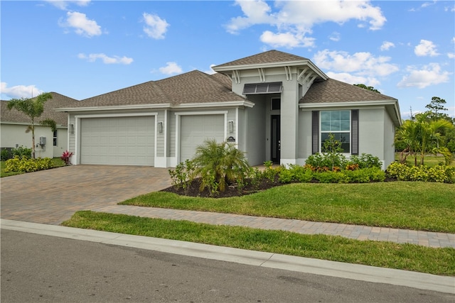 view of front of home with a garage and a front yard