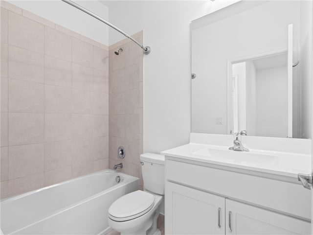 full bathroom with tiled shower / bath combo, toilet, and vanity