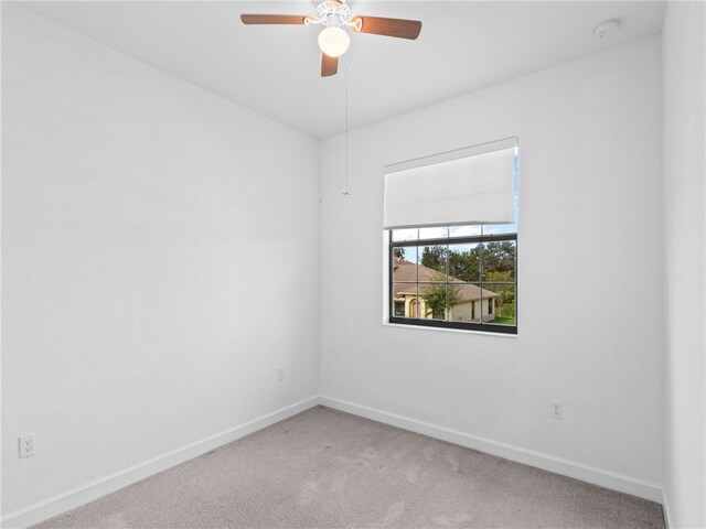 carpeted empty room with ceiling fan