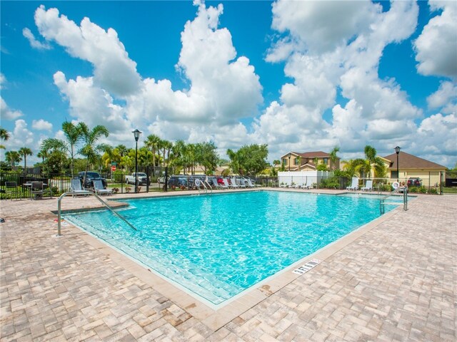 view of swimming pool with a patio